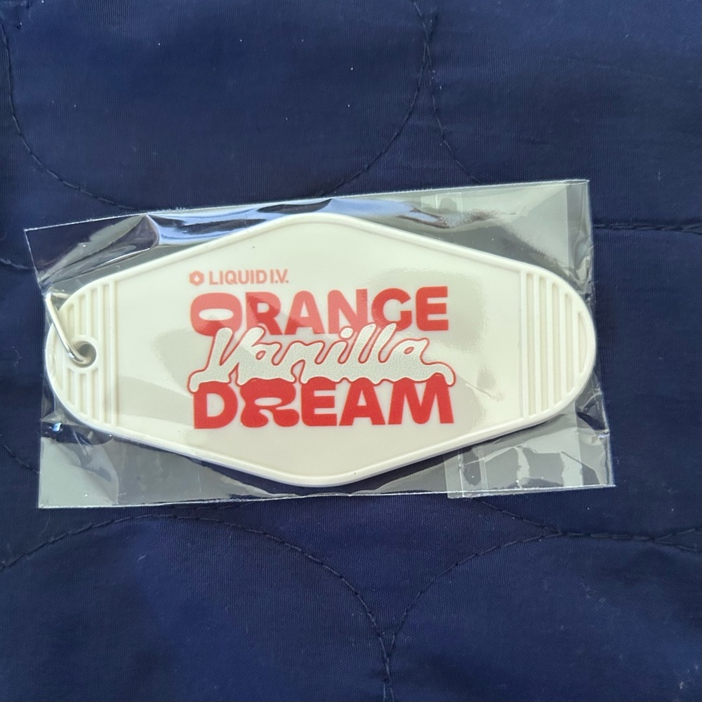 Liquid I.V. Orange Vanilla Dream retro motel-style keychain. NIB